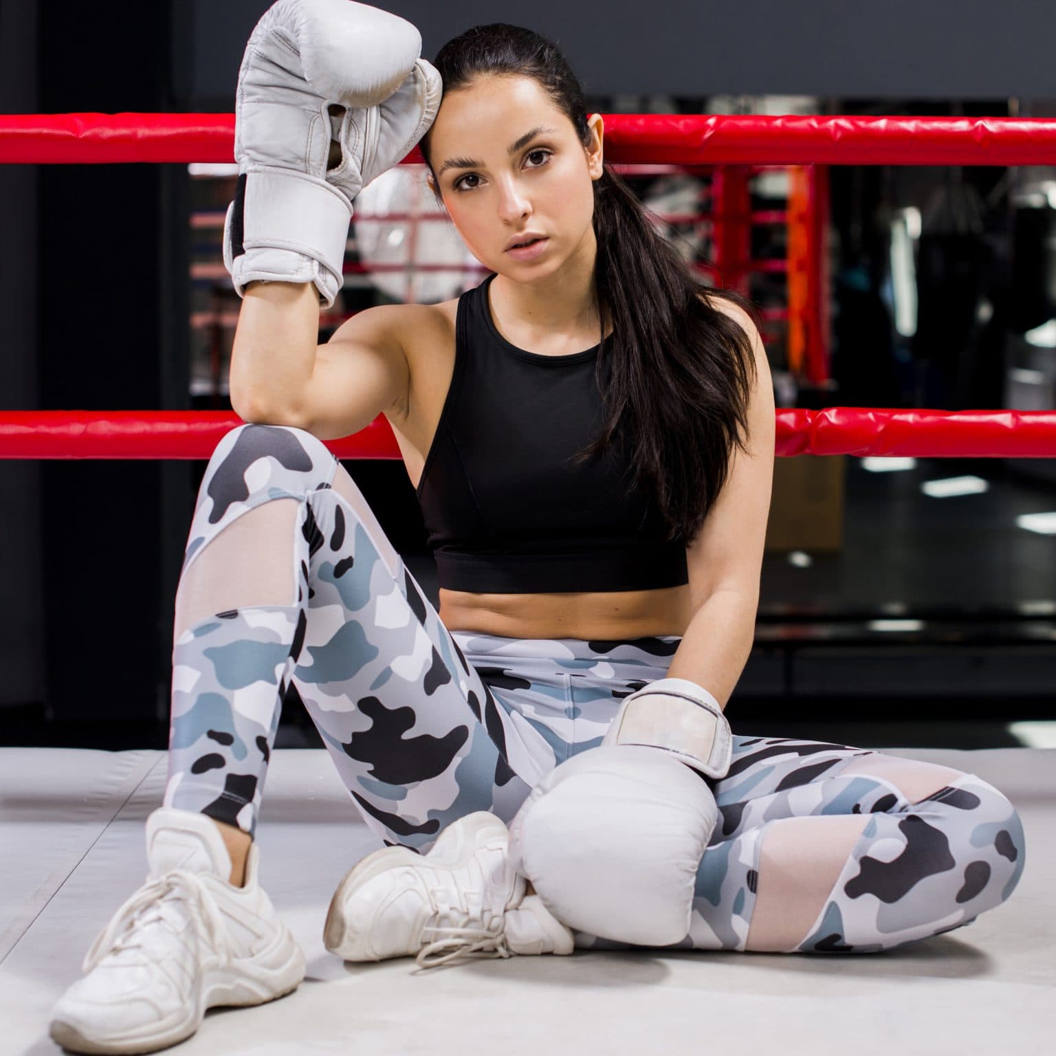 Athlete in the ring wearing boxing gloves